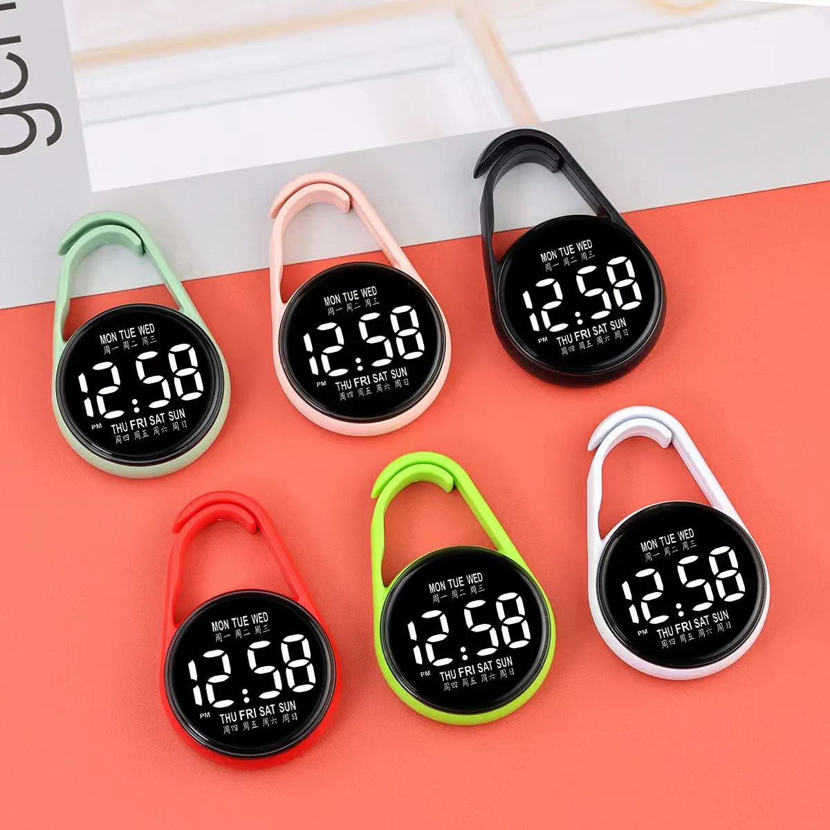 LED digital watch with week display on a plastic strap, shown in multiple colour options.