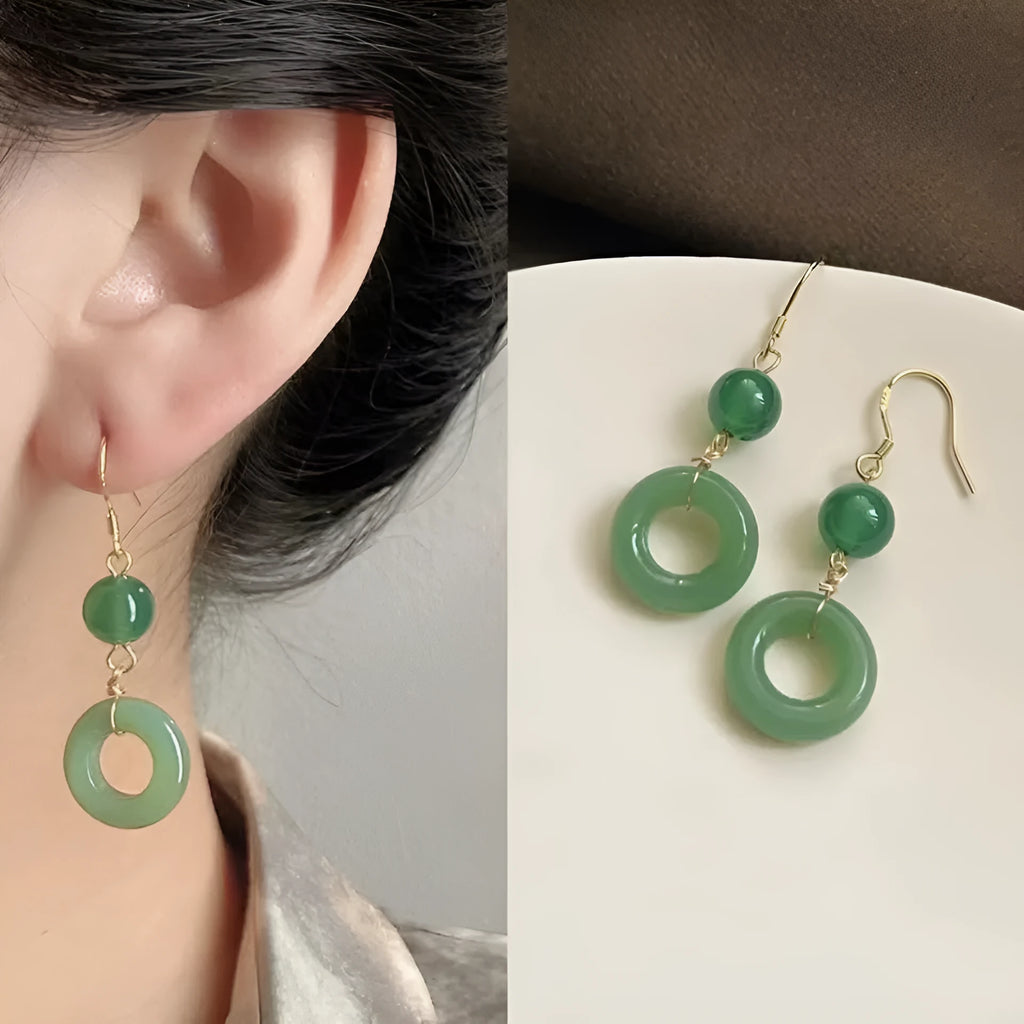 Green jade peace buckle shape earrings with zinc alloy construction and 14K gold plating
