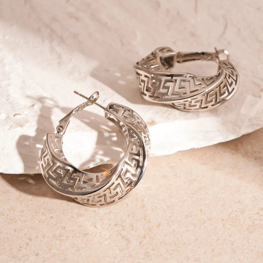 Geometric hollow stud earrings with twisted round design in silver or gold finish