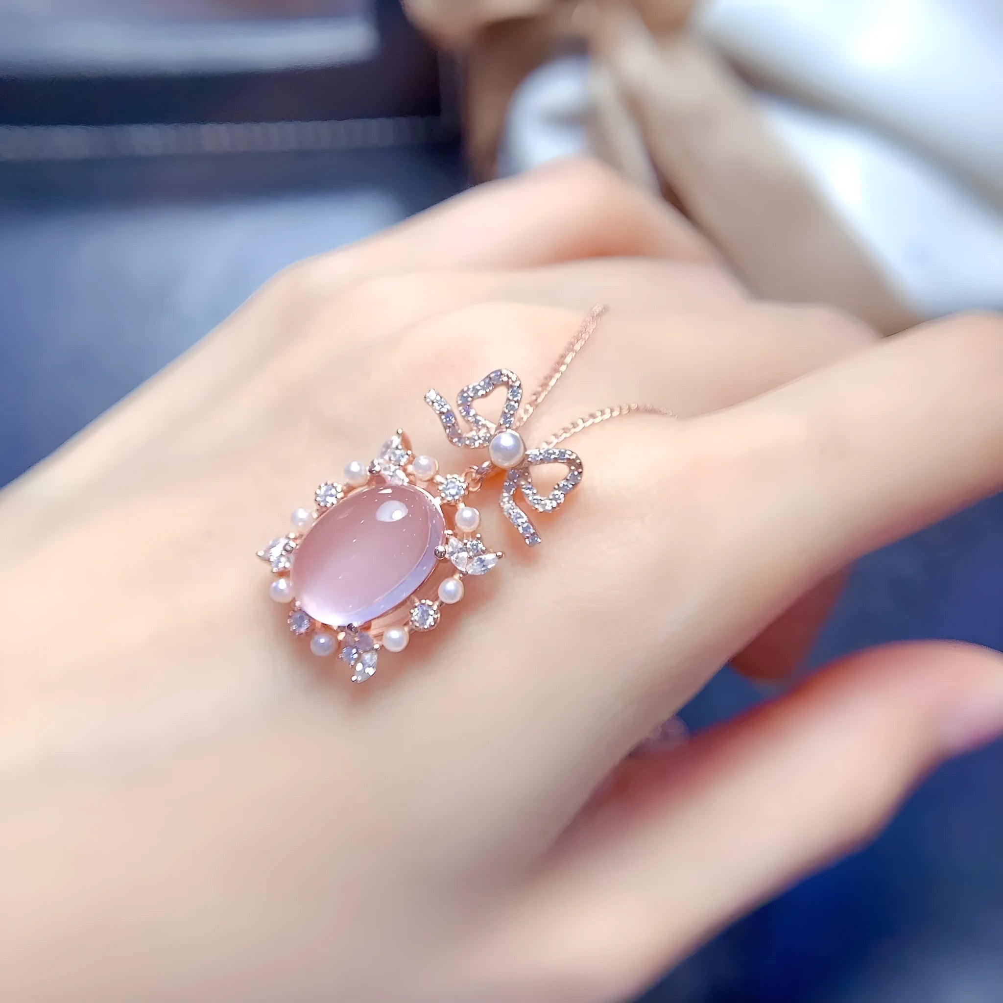 Geometric pink rose quartz pendant on a rose gold plated sterling silver necklace.