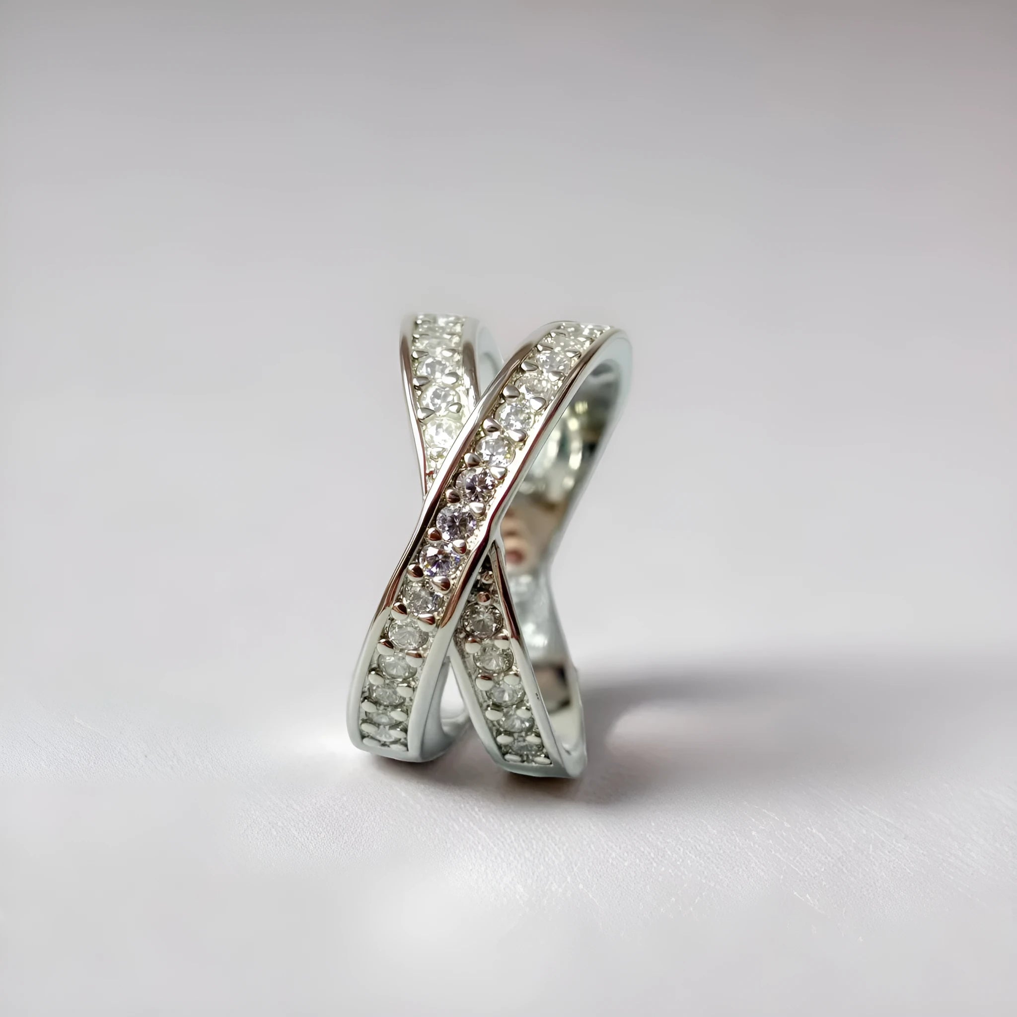 Metal cross ring with micro-inlaid zircon stones in silver or rose gold electroplated finish