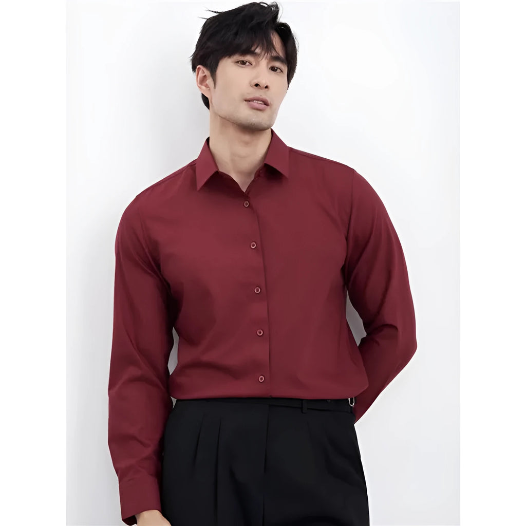 Man wearing a wine red slim fit long sleeve business casual shirt.