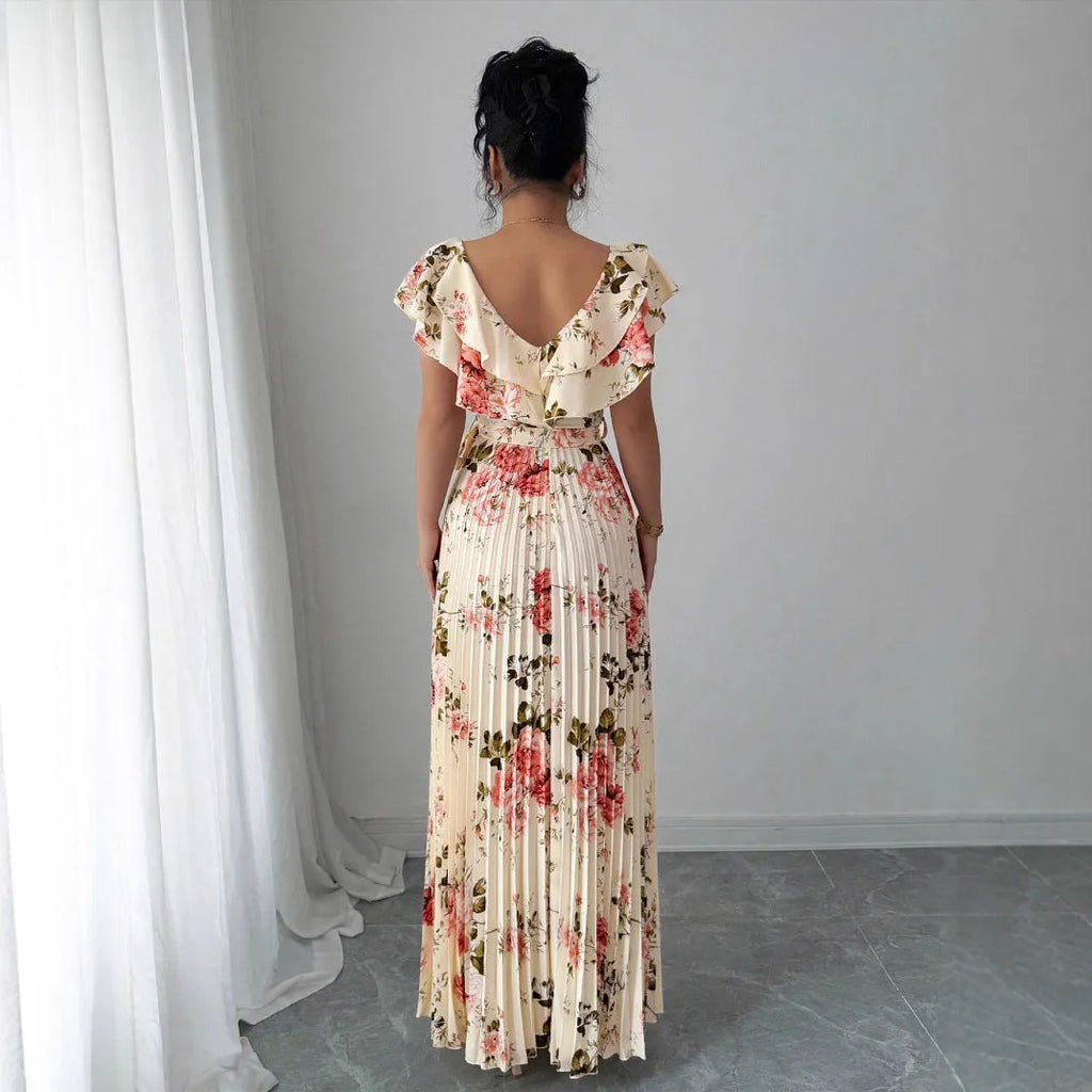 Apricot floral print dress with V-neck, ruffled short sleeves, and a high-waisted pleated swing skirt.