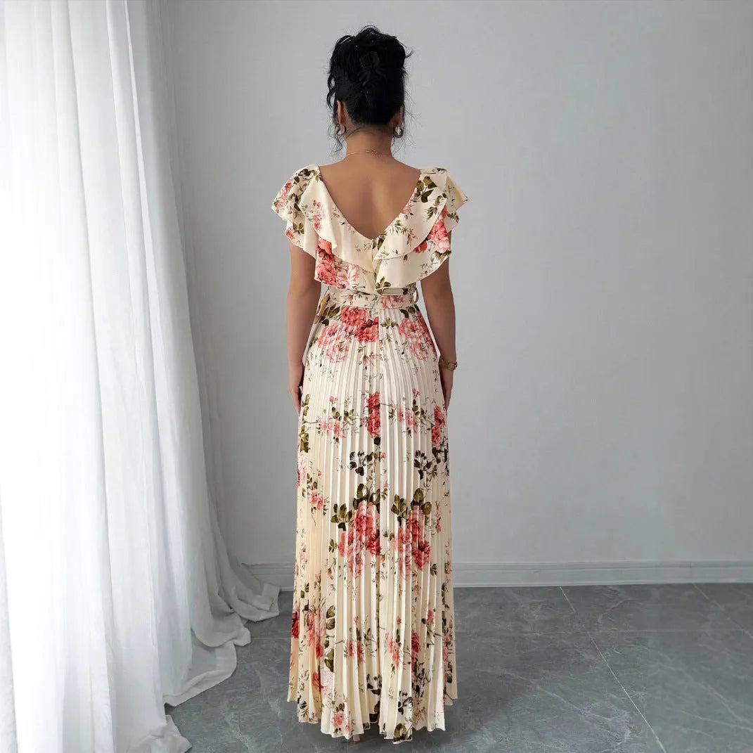 Apricot floral print dress with V-neck, ruffled short sleeves, and a high-waisted pleated swing skirt.
