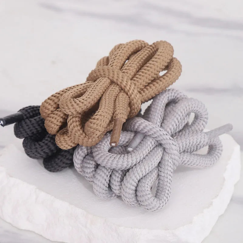 A pair of oval round-style shoelaces in a selected colour, showing their 1.0cm width and length.
