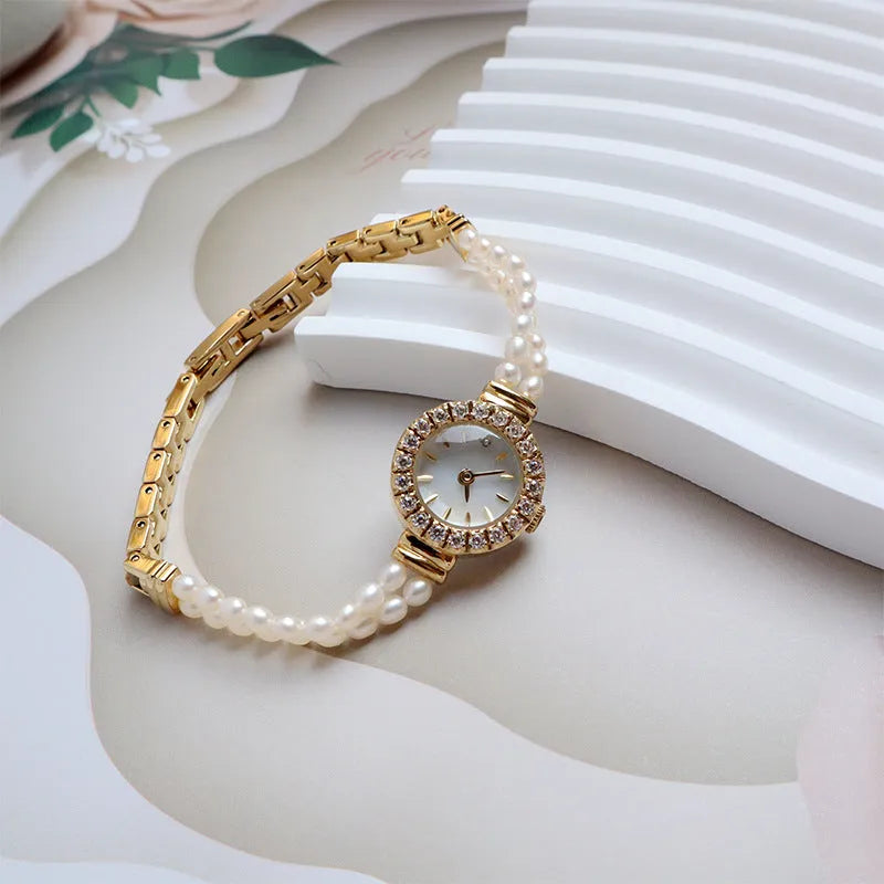 Women's light gold bracelet watch with freshwater pearls, 18mm round dial, single folding buckle