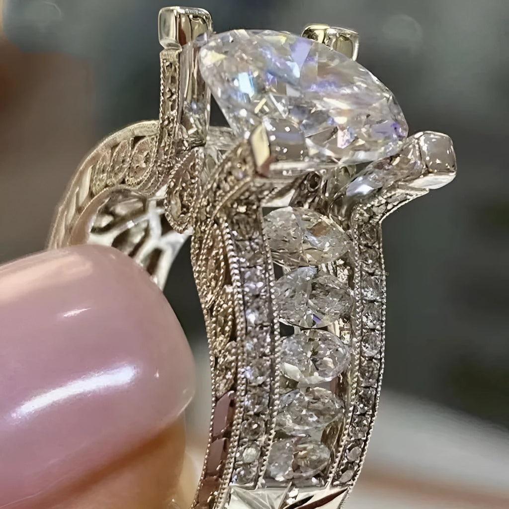 Geometric silver fashion engagement ring for women in gold or white electroplated finish on a size chart.