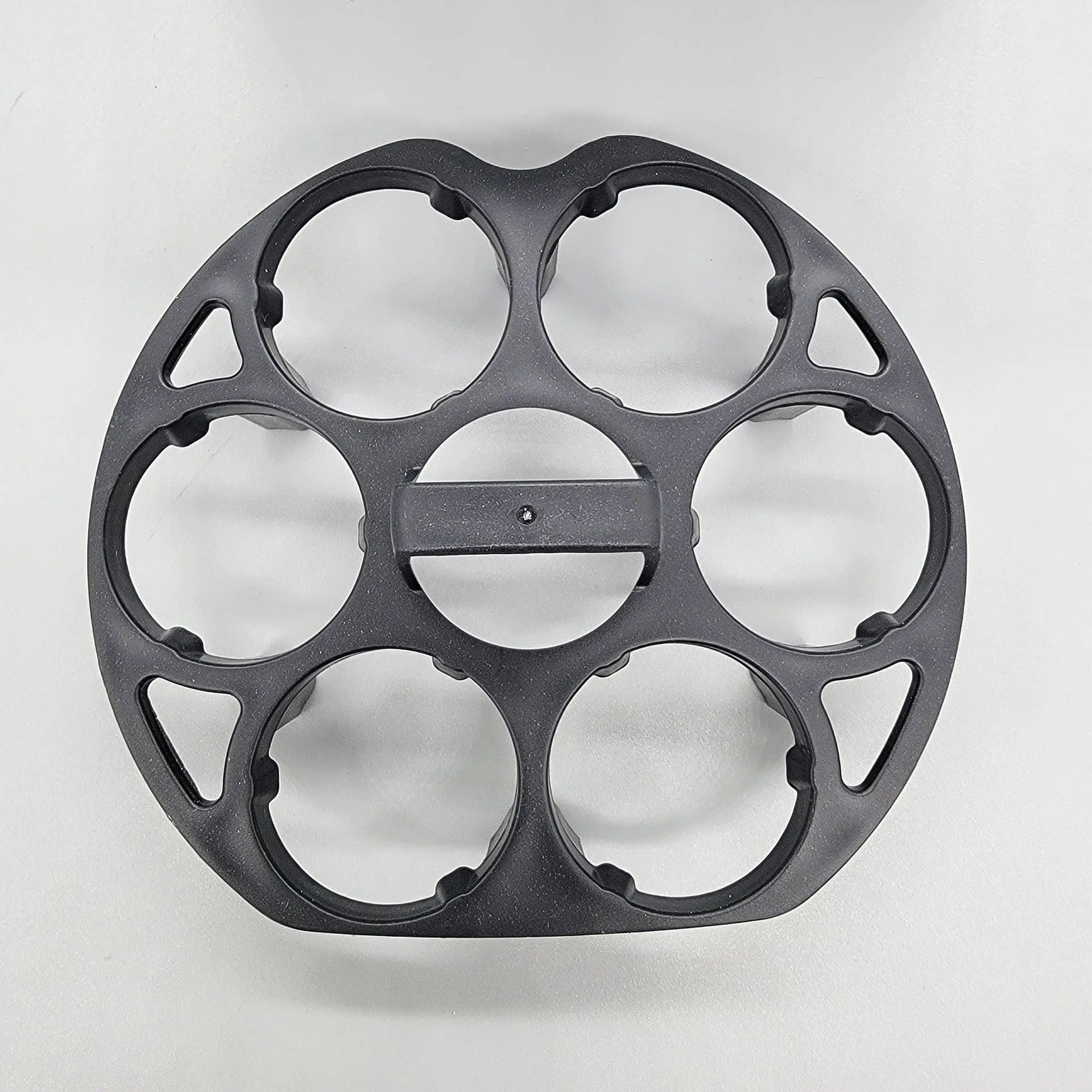 Black plastic egg holder measuring 13.8cm with retainer function for cooking machine storage