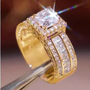 Geometric silver fashion engagement ring for women in gold or white electroplated finish on a size chart.