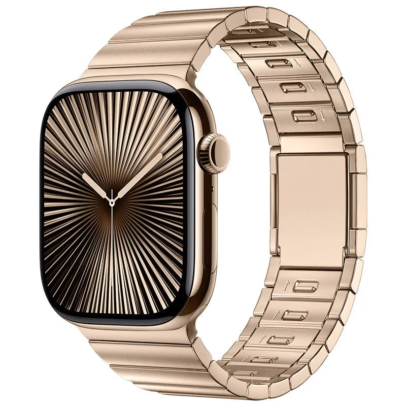Stainless steel magnetic buckle Apple Watch replacement band in silver colour on a wrist.