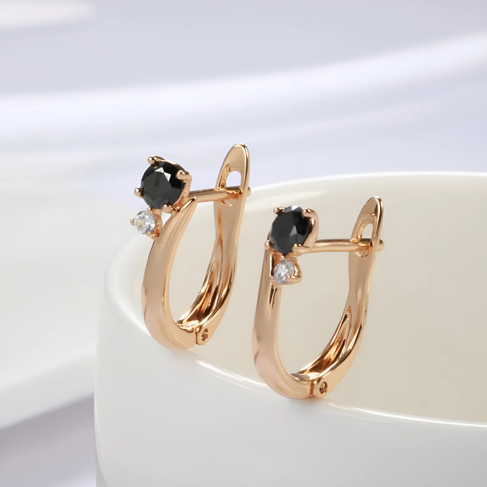Gold colour geometric drop earrings with a black agate stone inlay for women.