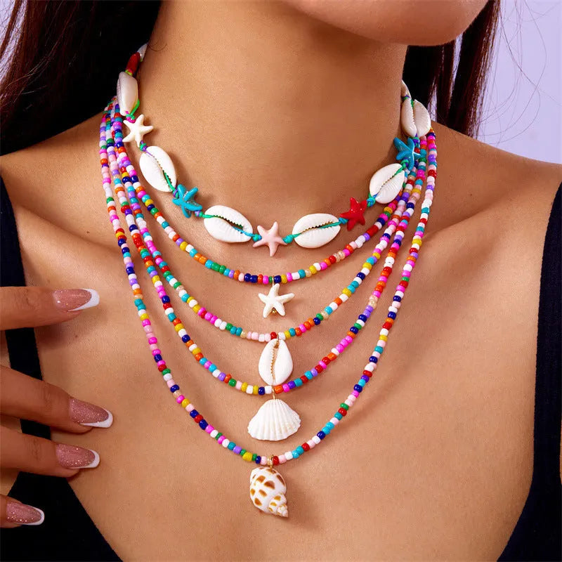 Blue shell and starfish pendant necklace set with five pieces on 21-50cm chains