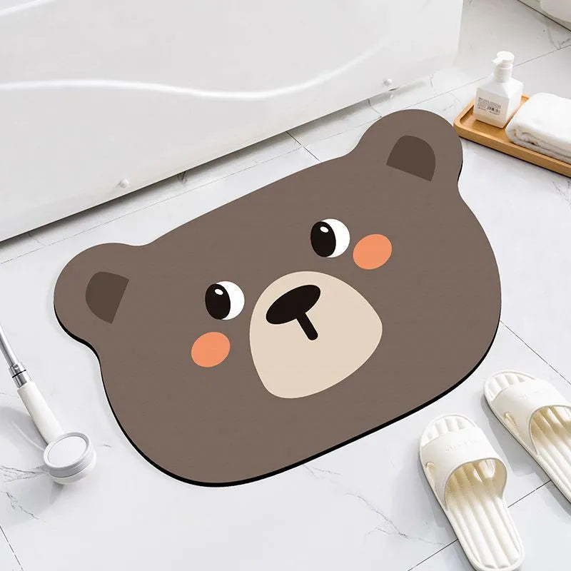 Colourful cartoon animal diatomite absorbent bathroom mat in alien shape on tiled floor.
