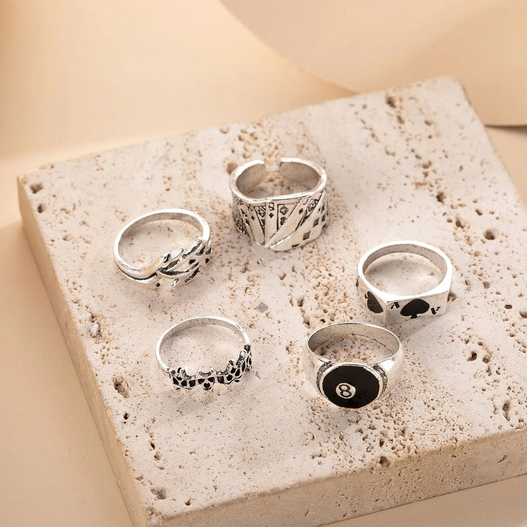 Black alloy poker ring with raised spade card design and adjustable band