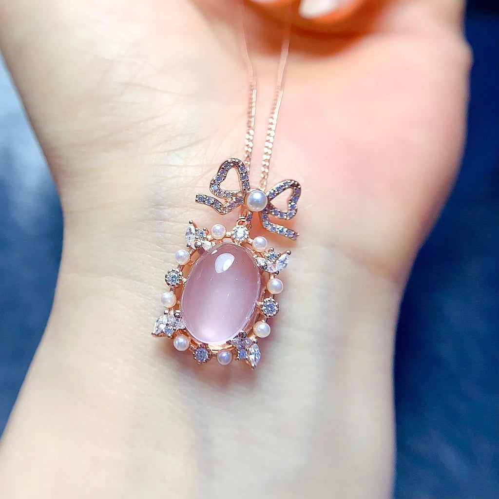 Geometric pink rose quartz pendant on a rose gold plated sterling silver necklace.