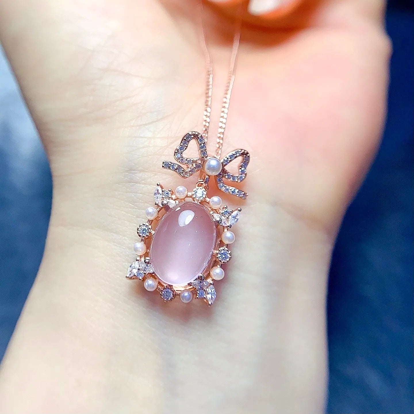 Geometric pink rose quartz pendant on a rose gold plated sterling silver necklace.