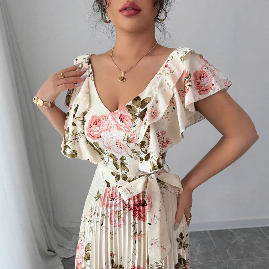 Apricot floral print dress with V-neck, ruffled short sleeves, and a high-waisted pleated swing skirt.
