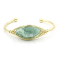 Raw gemstone bracelet with rough 8mm crystal beads in amorphous shapes on wrist, showing unisex ethnic style.