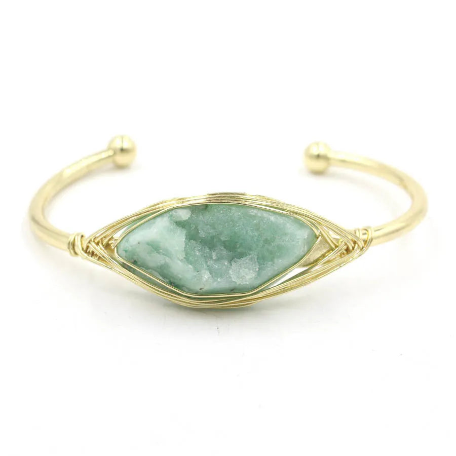 Raw gemstone bracelet with rough 8mm crystal beads in amorphous shapes on wrist, showing unisex ethnic style.