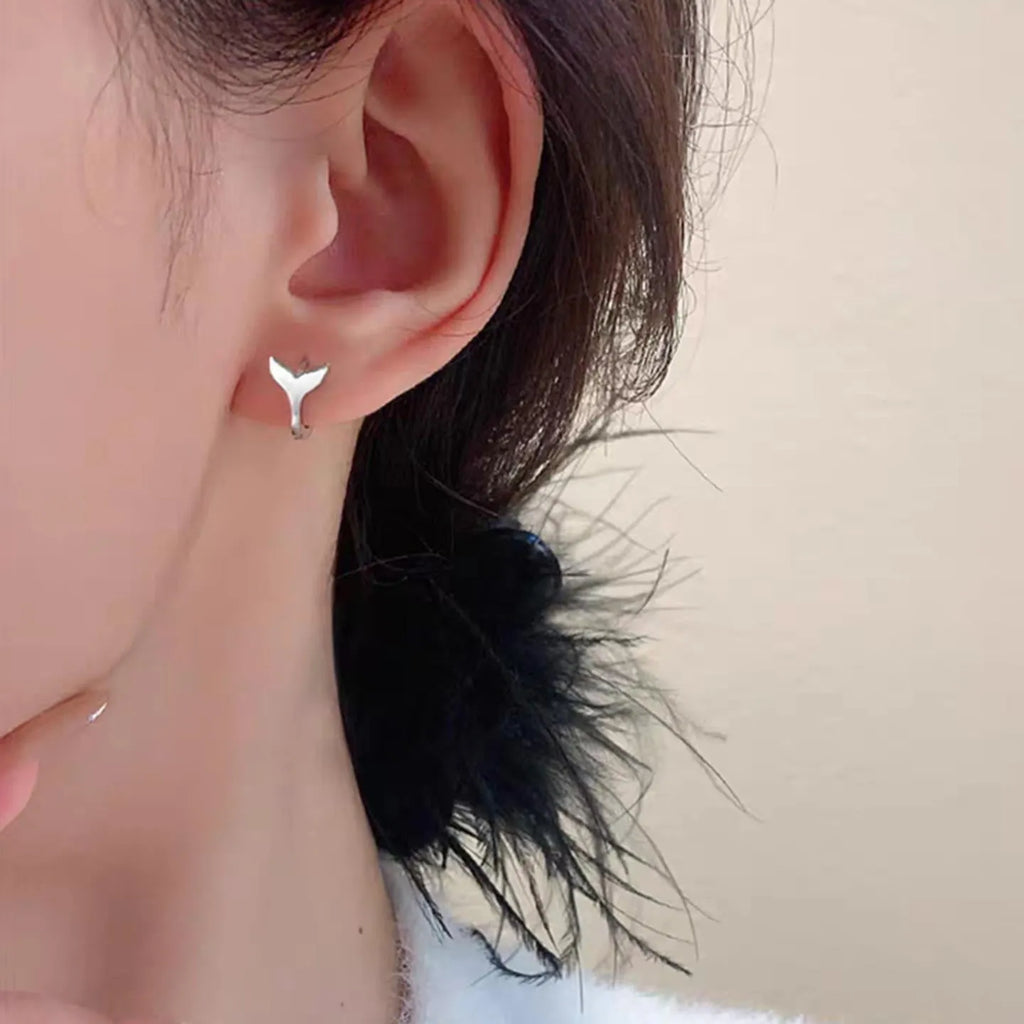 Women's fishtail design earrings in electroplated gold finish on copper
