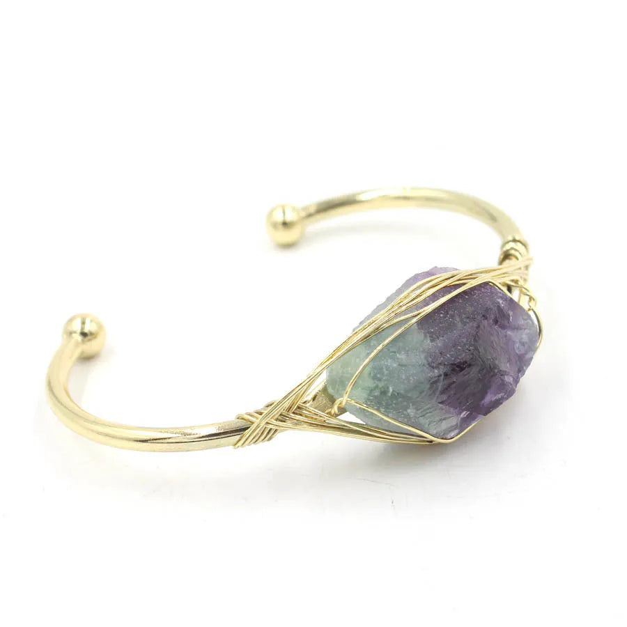 Raw gemstone bracelet with rough 8mm crystal beads in amorphous shapes on wrist, showing unisex ethnic style.