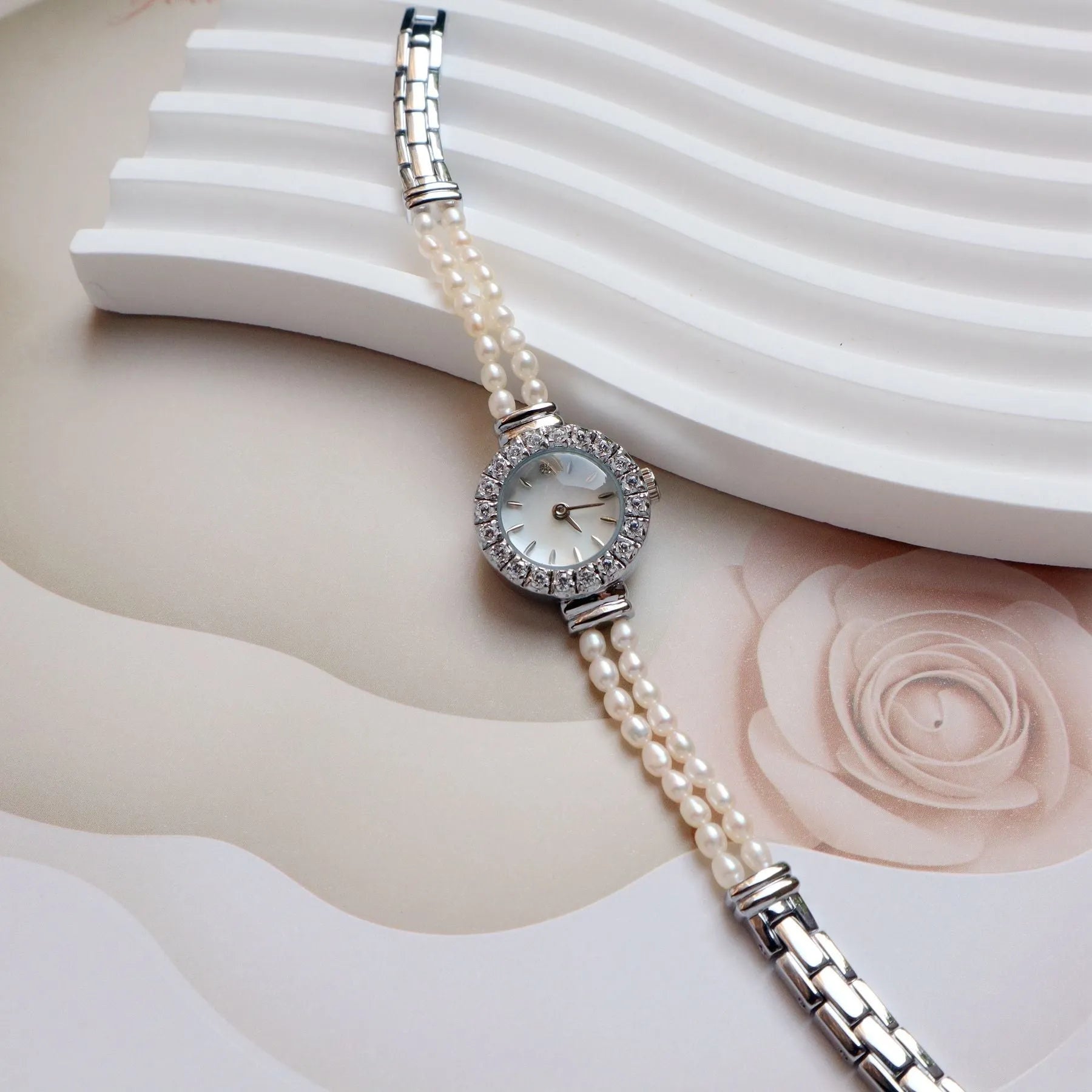 Women's light gold bracelet watch with freshwater pearls, 18mm round dial, single folding buckle