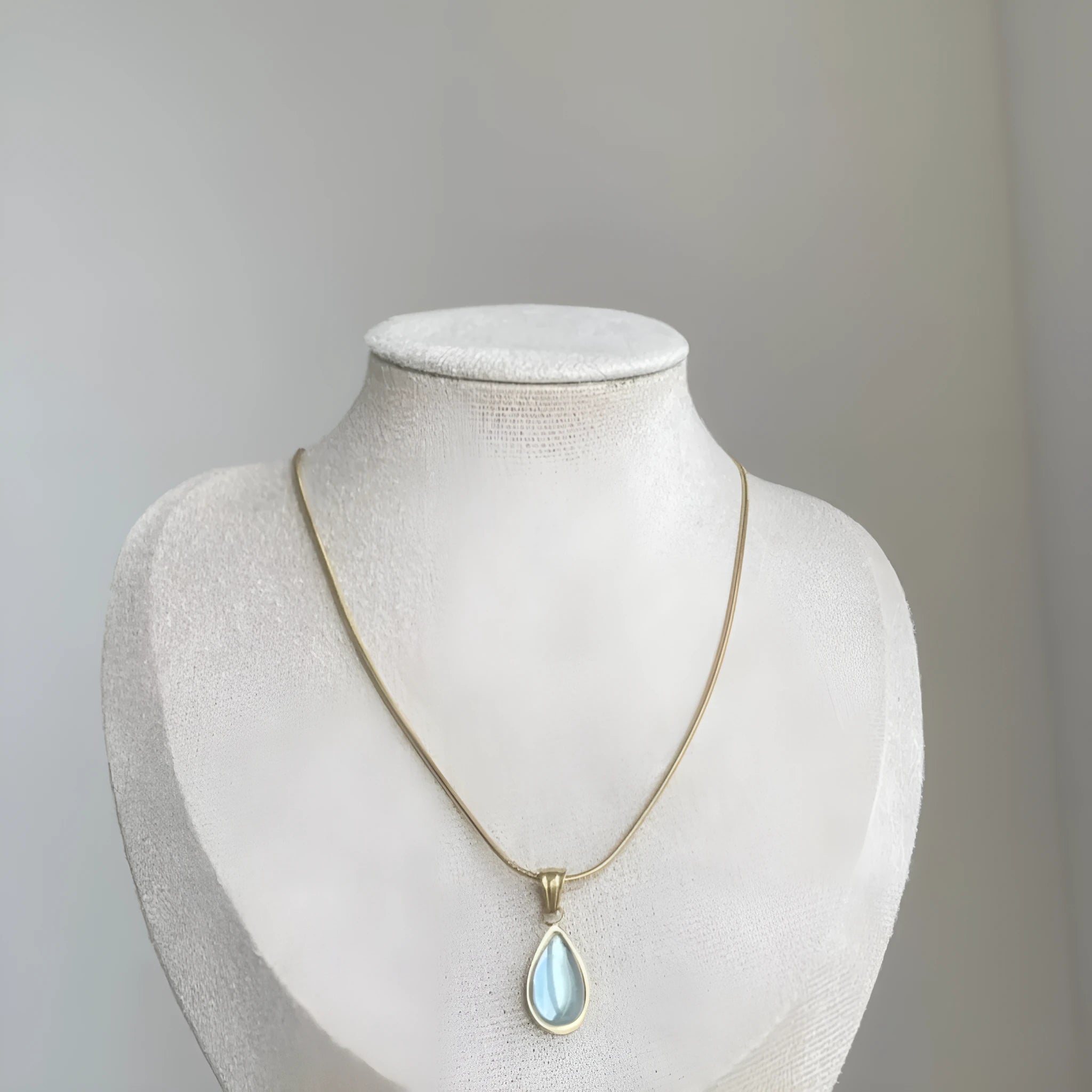 Retro water drop necklace with blue gemstone pendant on titanium steel snake bone chain