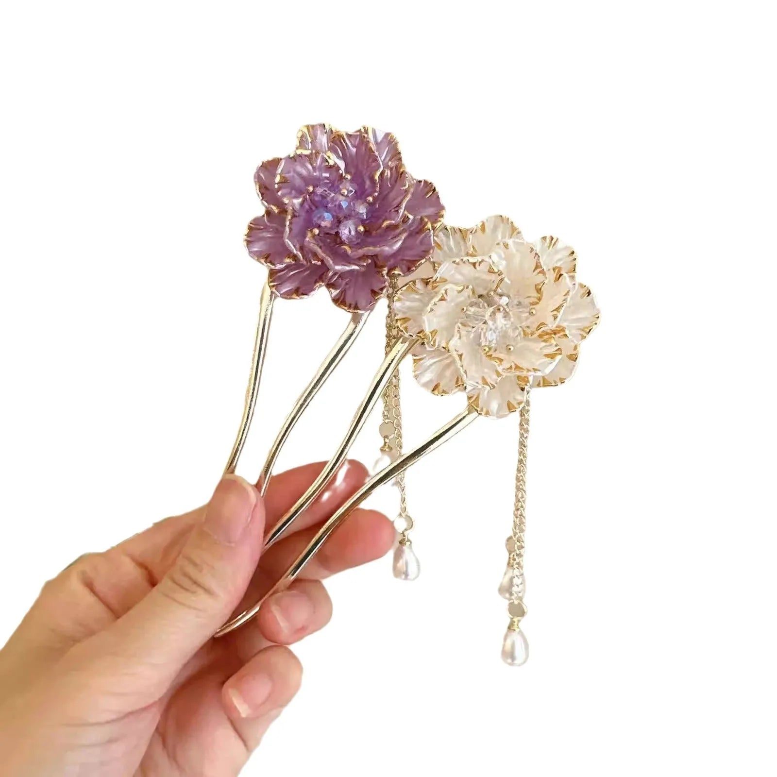 Close-up of a purple and white alloy U-shaped hairpin with a peony flower and tassel design.