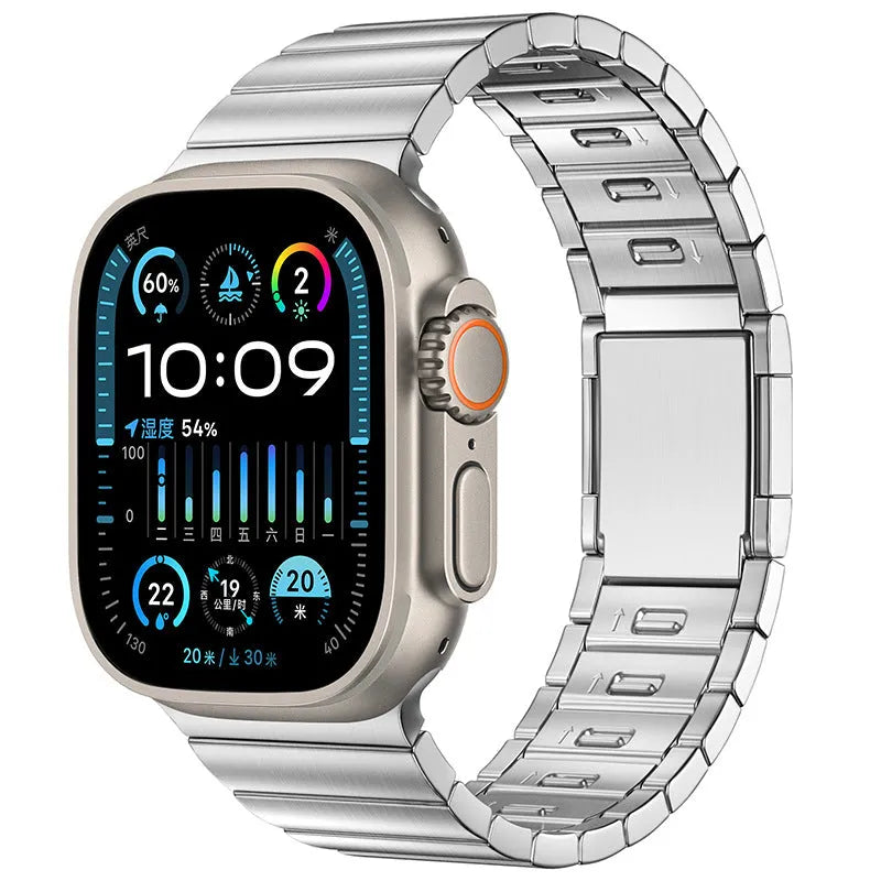 Stainless steel magnetic buckle Apple Watch replacement band in silver colour on a wrist.