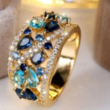 Women's round hollow copper ring with a central stone, shown in gold and platinum finishes.