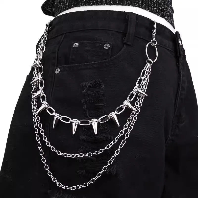 Silver metal punk pants chain with rivets and zipper detail, shown draped on trousers.