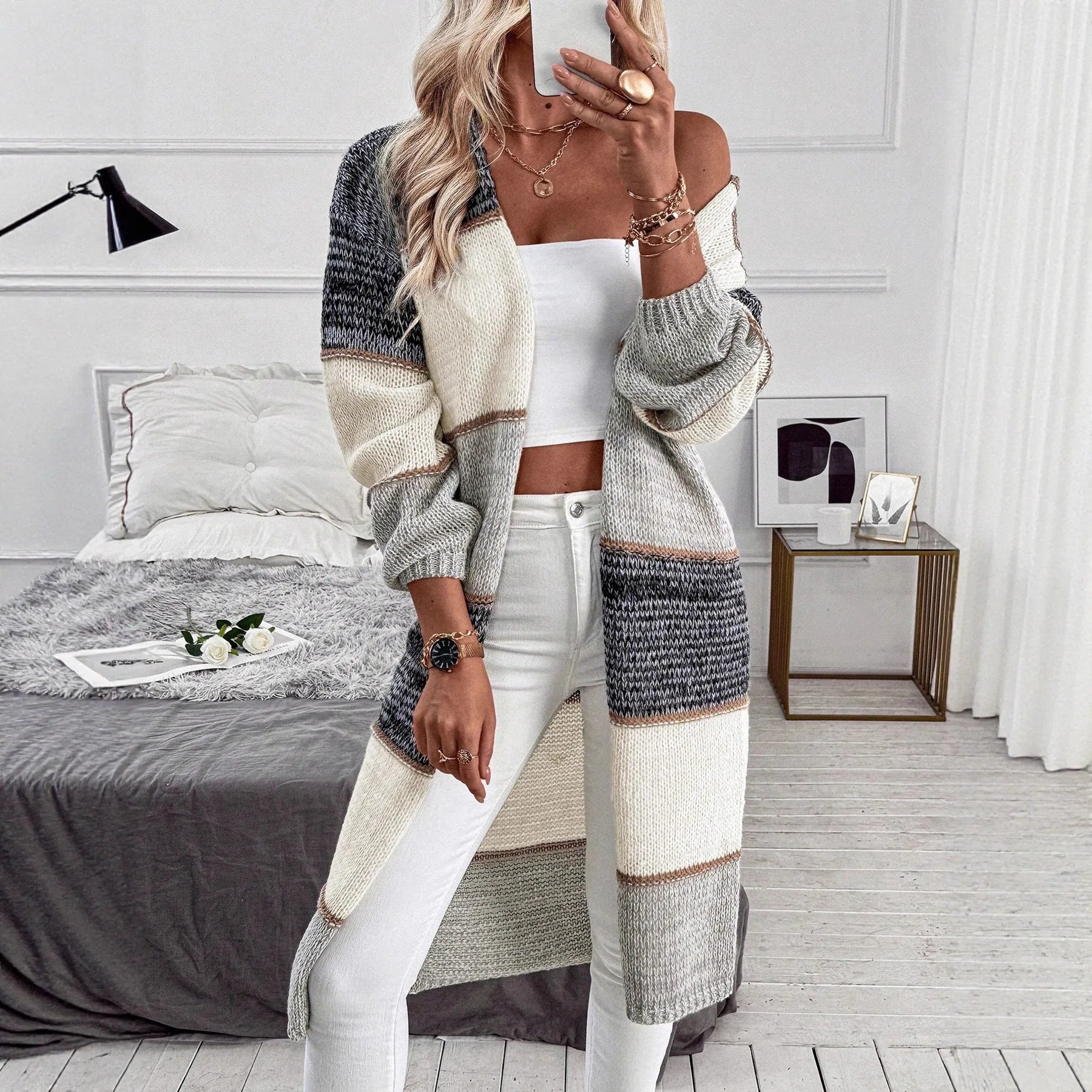 Grey striped women's knitted cardigan with loose fit and long sleeves