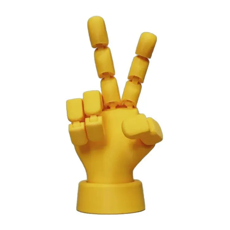 Yellow PLA plastic hand ornament with movable finger joints measuring 5 x 5.38 x 7.5 cm