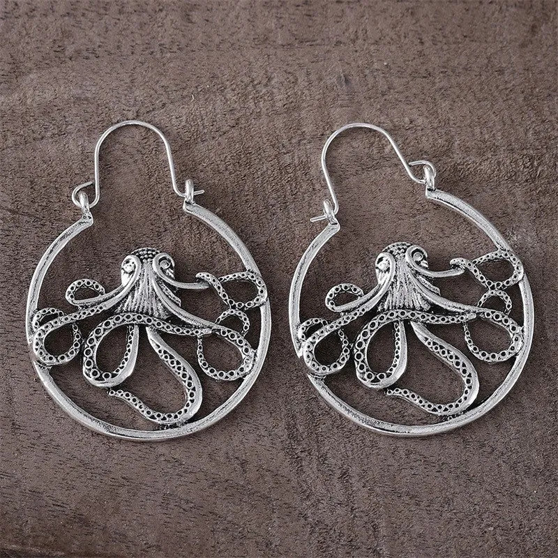 Vintage antique silver octopus earrings with detailed tentacles, retro animal zodiac design.