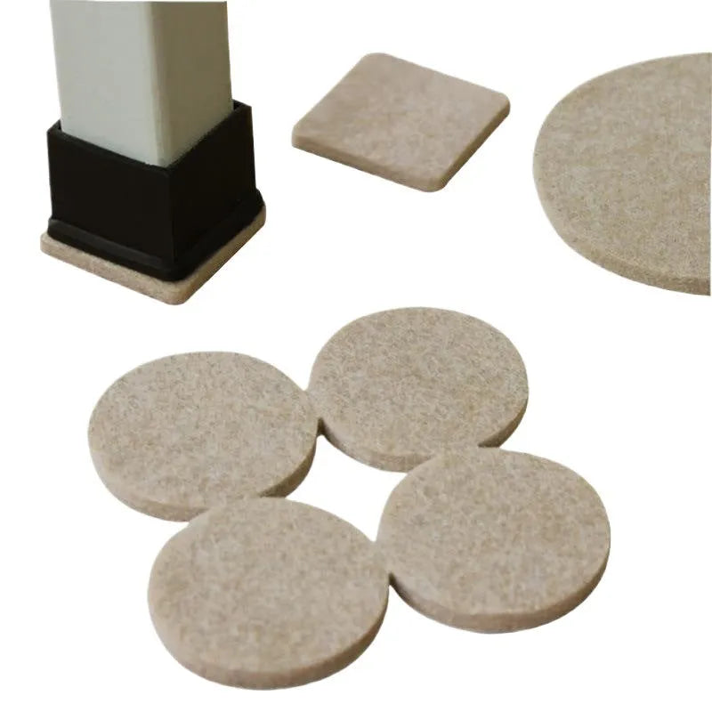 Assorted beige plastic furniture leg protectors in round and square shapes on hardwood floor
