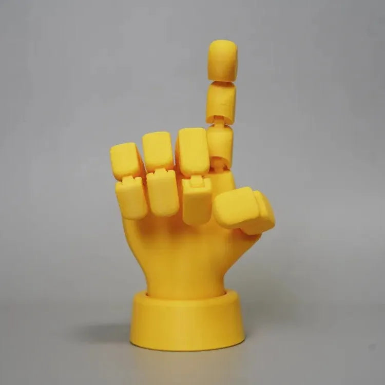 Yellow PLA plastic hand ornament with movable finger joints measuring 5 x 5.38 x 7.5 cm