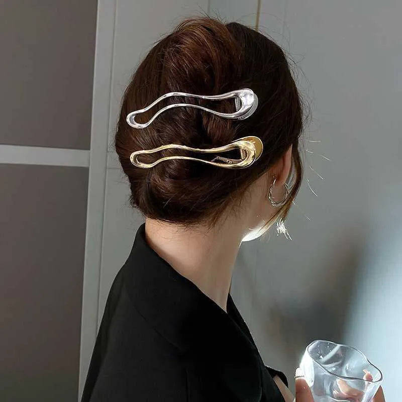 Gold and silver zinc alloy women's hair barrettes in arc, square, and triangle shapes.