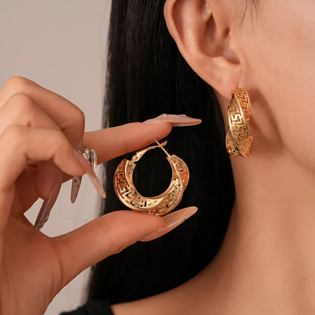 Geometric hollow stud earrings with twisted round design in silver or gold finish