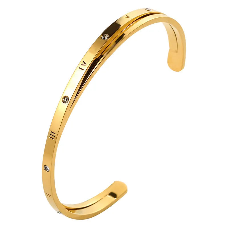 Open-ended stainless steel women's bracelet with inlaid zirconia stones in rose gold colour.