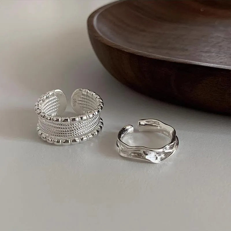 Adjustable opening geometric copper ring with woven twisted multilayer design