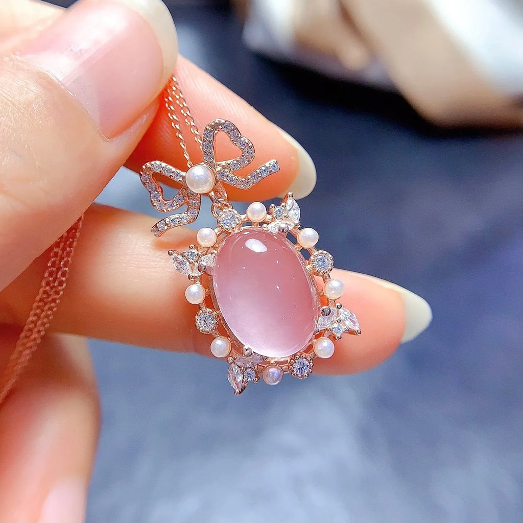 Geometric pink rose quartz pendant on a rose gold plated sterling silver necklace.