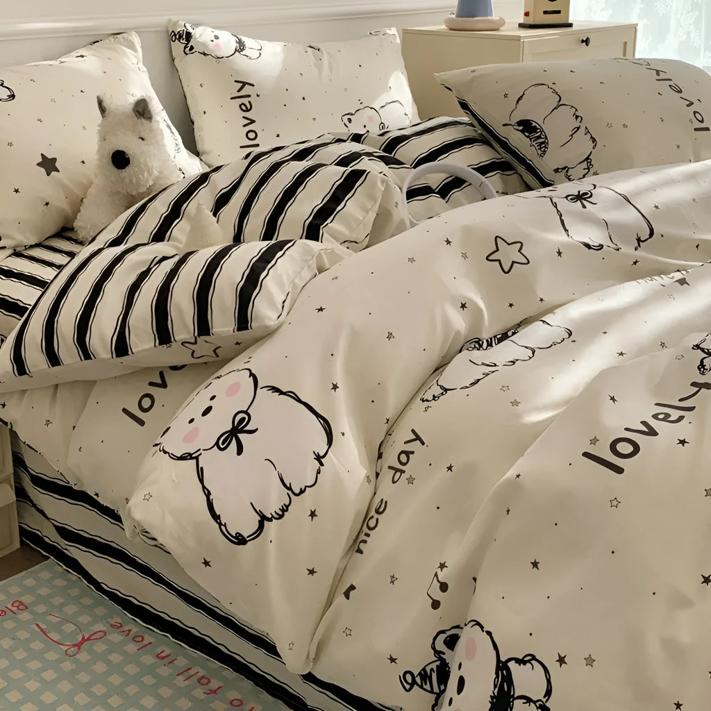 Cartoon dog pattern pure cotton four-piece quilt cover and bed sheet set on a bed