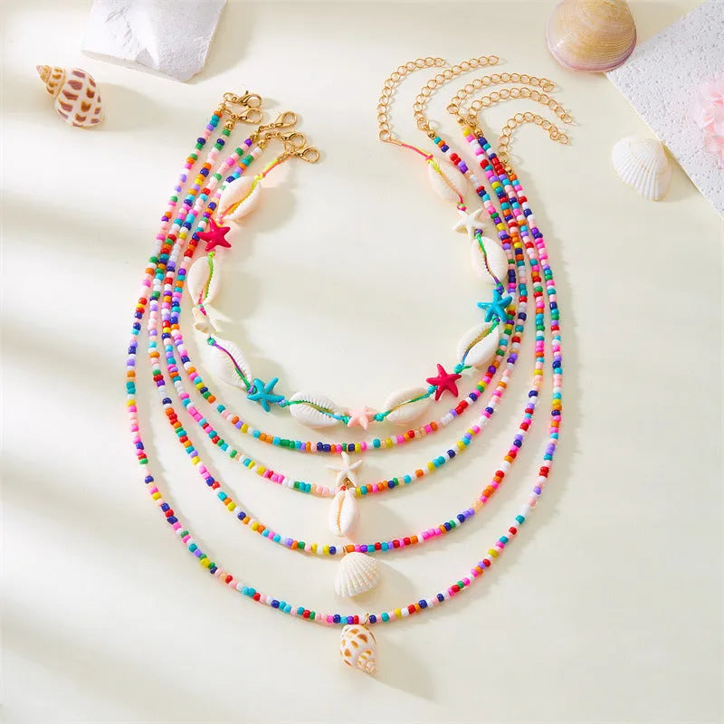 Blue shell and starfish pendant necklace set with five pieces on 21-50cm chains