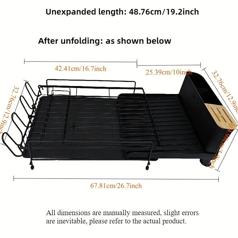 A retractable, foldable carbon steel kitchen drain rack holding cutlery and cups.