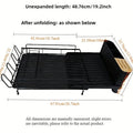 A retractable, foldable carbon steel kitchen drain rack holding cutlery and cups.