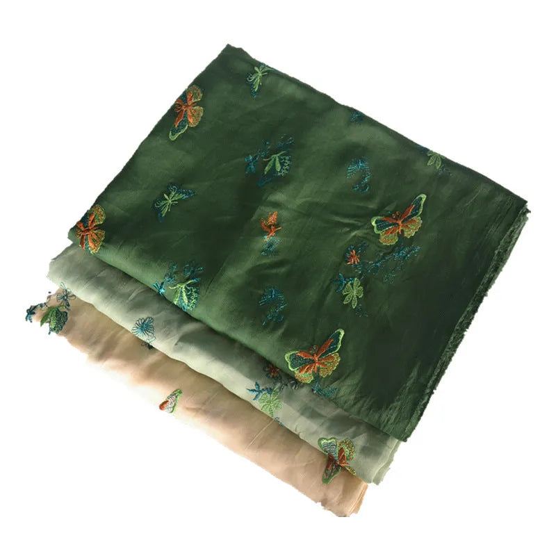 Pure ramie hanfu fabric in beige, dark green and grass green colours showing texture