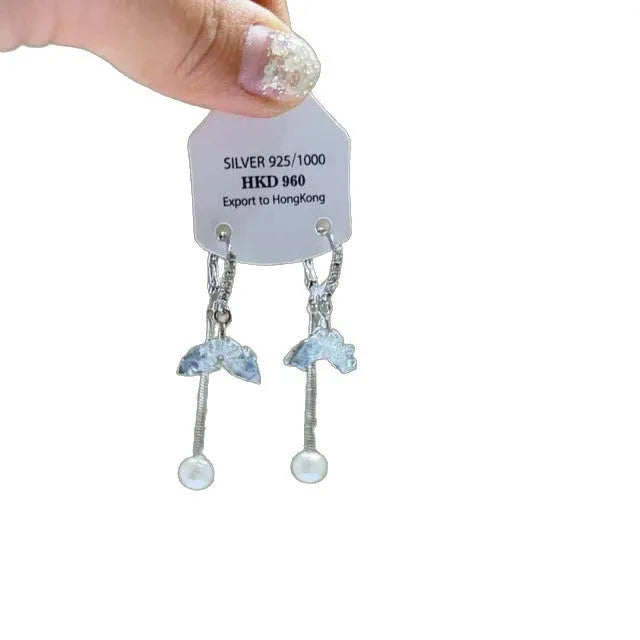 Geometric heart-shaped alloy ear clips with rhinestone accents and dangling star tassels in silver-tone