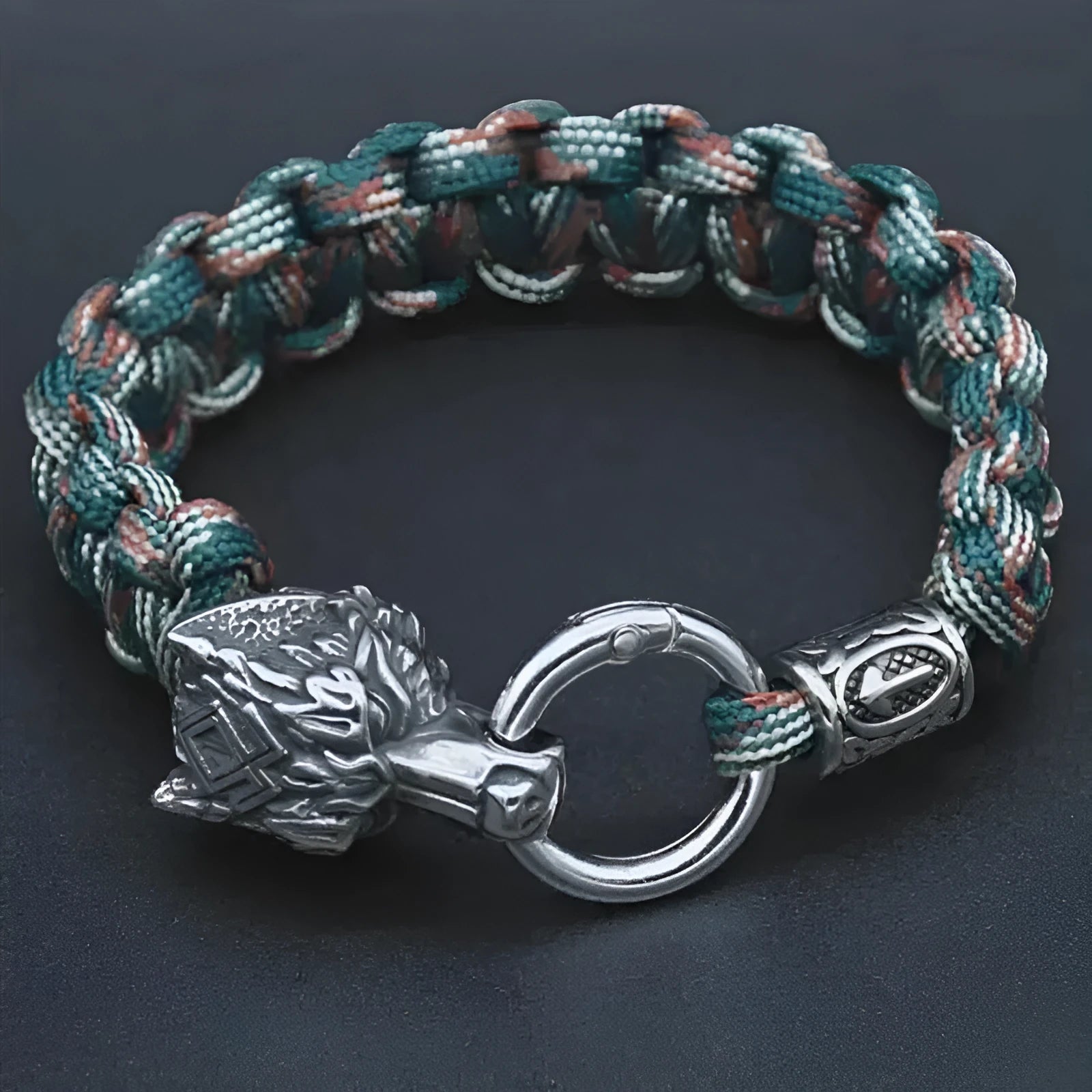 Handmade titanium steel wolf head bracelet with camouflage colour finish showing polished surface detail