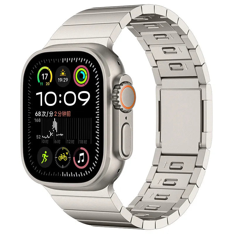 Stainless steel magnetic buckle Apple Watch replacement band in silver colour on a wrist.