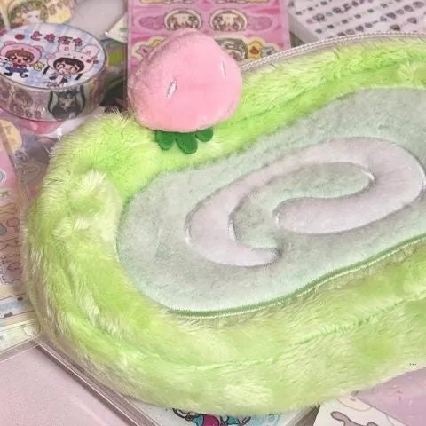 Honeydew roll plush velvet pencil case with Swiss roll cake design in beige, brown, and cream colours